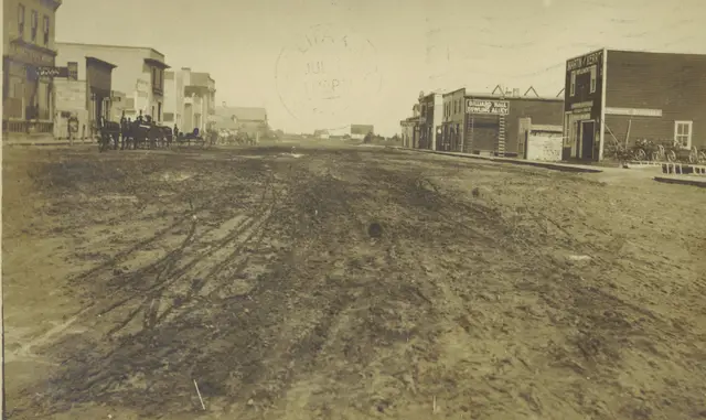 Muddy main street with Billiard Hall and Bowling Alley